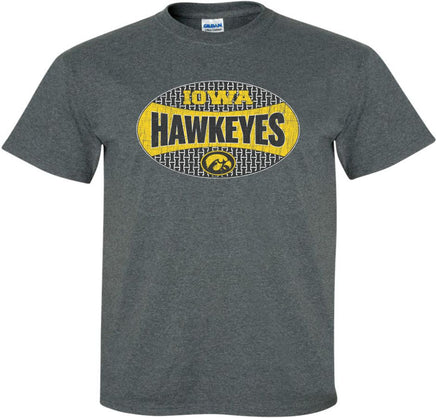 Show off your Hawkeye Pride with this unique Iowa Hawkeye shirt. This design has Iowa Hawkeyes and a Tigerhawk in an oval. The top and bottom parts of the oval have an "I" pattern. Printed on a pre-shrunk, 50/50 cotton/poly dark gray t-shirt with white, gold and black ink. All of our Iowa Hawkeye designs are Officially Licensed and approved by the University of Iowa.