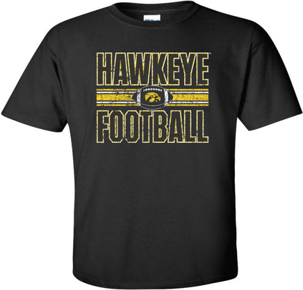 This Hawkeye Football design features a football with the Tigerhawk and the stripes that are on the Iowa Football uniforms. Printed on a pre-shrunk, 100% cotton black t-shirt with white, black and gold ink. All of our Iowa Hawkeye designs are Officially Licensed and approved by the University of Iowa.