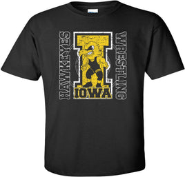 The perfect shirt to Cheer on our Iowa Hawkeye Wrestlers at Carver-Hawkeye Arena! This design features the Wrestling Herky on a big "I" and a wrestling circle. The design also says Iowa Hawkeyes Wrestling. Printed on a pre-shrunk, 100% cotton black t-shirt with white, gold and black ink. All of our Iowa Hawkeye designs are Officially Licensed and approved by the University of Iowa.