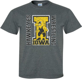 The perfect shirt to Cheer on our Iowa Hawkeye Wrestlers at Carver-Hawkeye Arena! This design features the Wrestling Herky on a big "I" and a wrestling circle. The design also says Iowa Hawkeyes Wrestling. Printed on a pre-shrunk, 50/50 cotton/poly dark gray t-shirt with white, gold and black ink. All of our Iowa Hawkeye designs are Officially Licensed and approved by the University of Iowa.