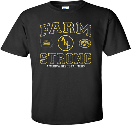 A black short-sleeve t-shirt with a gold, white and black design on the front that reads 'FARM STRONG' with 'AMERICA NEEDS FARMERS' underneath as well as the ANF circle logo,  Est. 1985 in the state of Iowa, and the oval Tigerhawk.