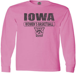 Are you ready to cheer on our Iowa Women's Basketball team at Carver Hawkeye Arena? This design has Iowa Women's Basketball and the oval Tigerhawk logo in a basketball net. Printed on a pre-shrunk, 100% cotton azalea pink long sleeve t-shirt with black ink. All of our Iowa Hawkeye designs are Officially Licensed and approved by the University of Iowa.