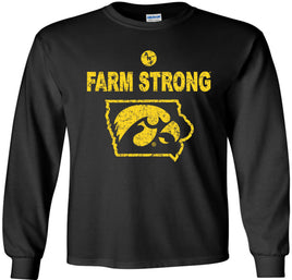 A black long-sleeve t-shirt with a distressed gold design on the front that reads 'FARM STRONG' above an outline of the state of Iowa containing the Tigerhawk logo. 