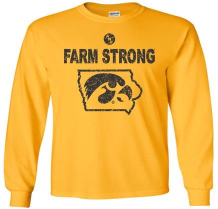 A gold long-sleeve t-shirt with a distressed black graphic on the front that reads 'FARM STRONG' above a state outline containing the Iowa Hawkeyes Tigerhawk logo. 
