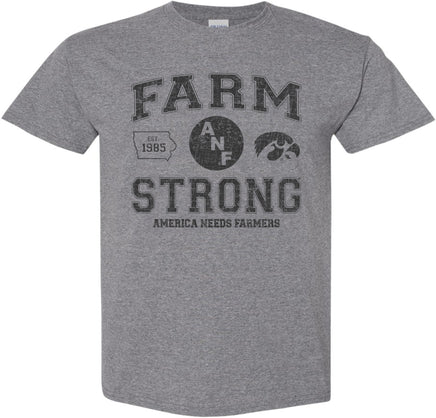 A medium gray short-sleeve t-shirt with a distressed black design on the front that reads 'FARM STRONG' with 'AMERICA NEEDS FARMERS' underneath, alongside the ANF logo and the Iowa Hawkeyes Tigerhawk logo.