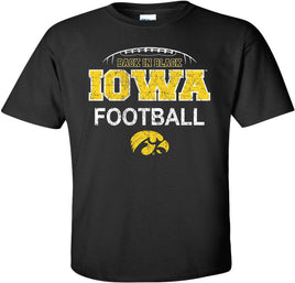 This Iowa football design is the perfect shirt to wear to Kinnick Stadium! This design has Iowa Football with the Tigerhawk. It also has football laces and Back in Black.&nbsp; Printed on a pre-shrunk, 100% cotton black t-shirt with white and gold ink. All of our Iowa Hawkeye designs are Officially Licensed and approved by the University of Iowa.