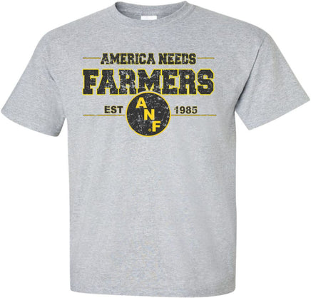 America Needs Farmers! ANF was established in 1985 during the Farm Crisis. Show your support our Iowa Farmers with this design that has American Needs Farmers with the circle ANF logo. The design also has Est. 1985. Printed on a pre-shrunk, 90/10 cotton/poly light gray t-shirt with black and gold ink. All of our Iowa Hawkeye designs are Officially Licensed and approved by the University of Iowa.